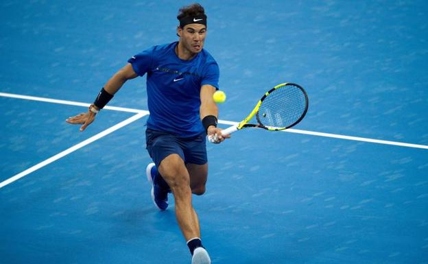 Nadal, durante la disputa del encuentro contra Pouille./ EFE